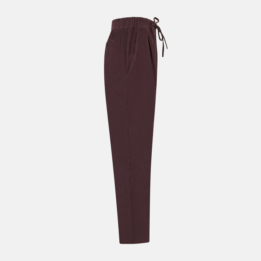 Turnbull & Asser Burgundy Corduroy Miles Trousers: high-waisted, straight-leg pants with an elasticated drawstring waist, shown on a white background.