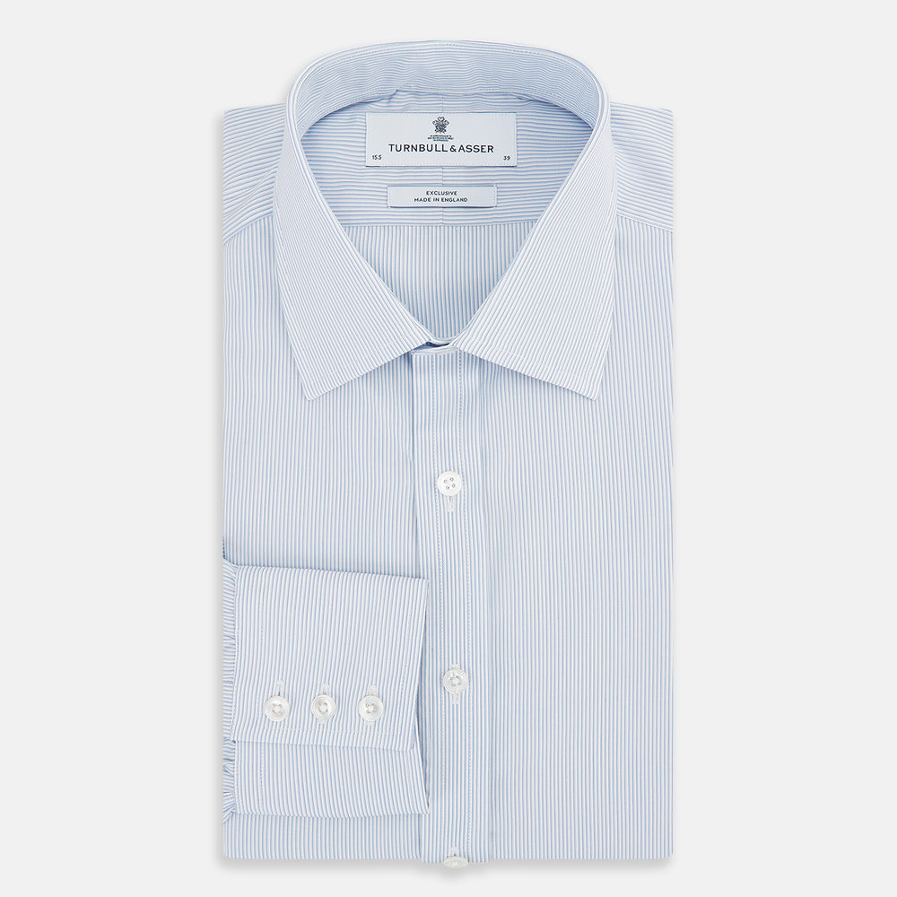 The Sky Blue Hairline Multi Stripe Mayfair Shirt by Turnbull & Asser, made from Italian cotton with a classic collar, white buttons, and buttoned cuffs, is displayed on a plain white background—an essential for any gentleman.
