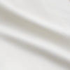View 3 of product The Cream Silk Holiday Fit Phillips Shirt by Turnbull & Asser is a short-sleeved, collared silk shirt in off-white with three front pockets and a revere collar, displayed flat on a plain white background.