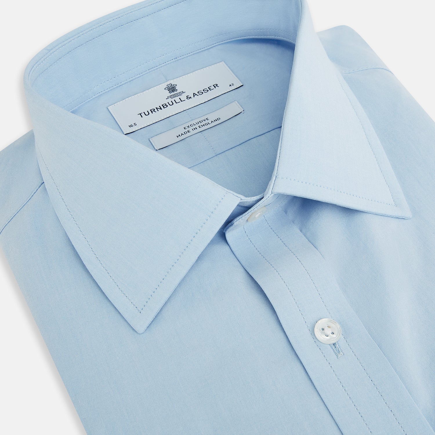 View 2 of product The Turnbull & Asser Sky Blue Mayfair Shirt is a long-sleeved, collared button-down made from sanforised cotton, shown laid flat on a white background.