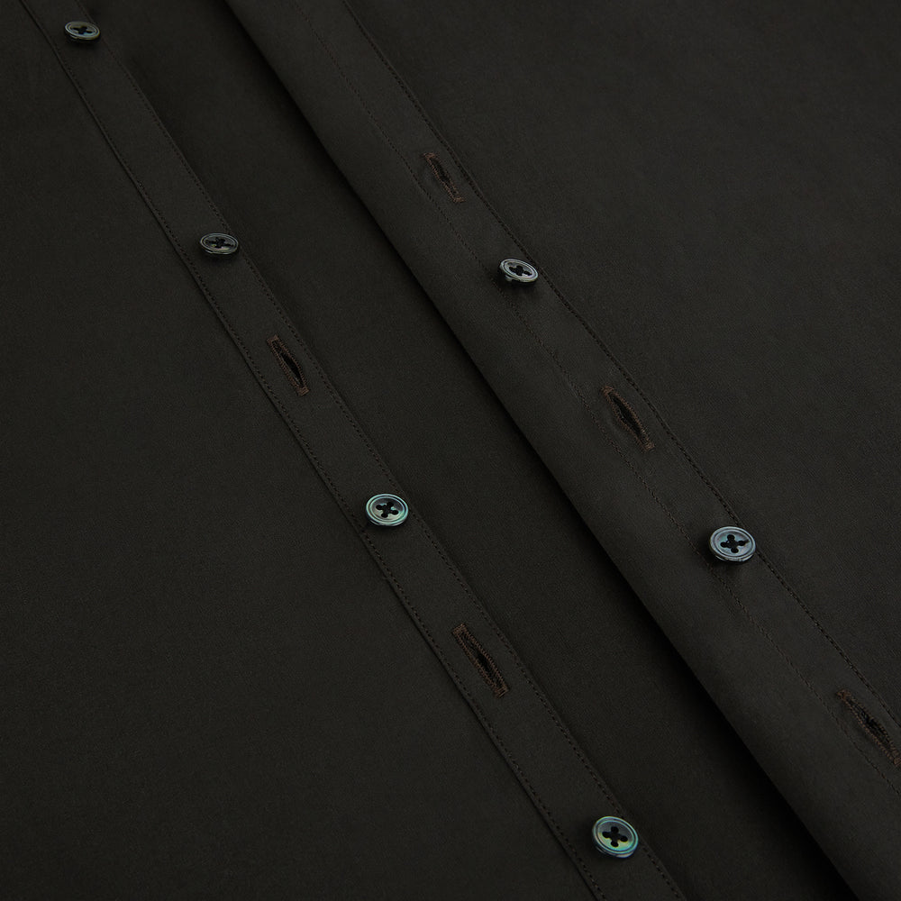 A brown Windsor long-sleeve button-up shirt by Turnbull & Asser with a classic collar, buttoned cuffs, and a straight hem, laid flat on a white background—showcasing refined British craftsmanship.