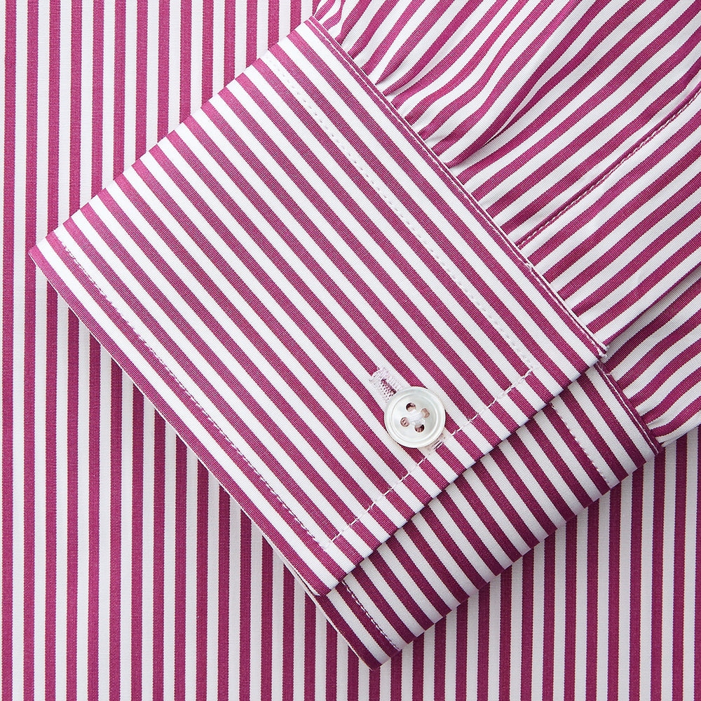 The Turnbull & Asser Purple & White Stripe Weekend Fit Shirt features a Derby collar, chest pocket, and 1-button cuffs—ideal for casual weekends.