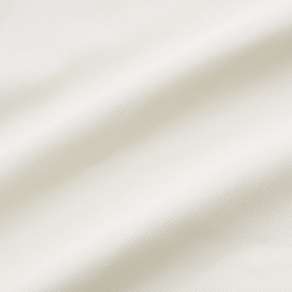 The Turnbull & Asser Cream Weekend Fit Hayne Shirt features a Dorset collar and 1-button cuffs, displayed long-sleeved and laid flat on a white background.