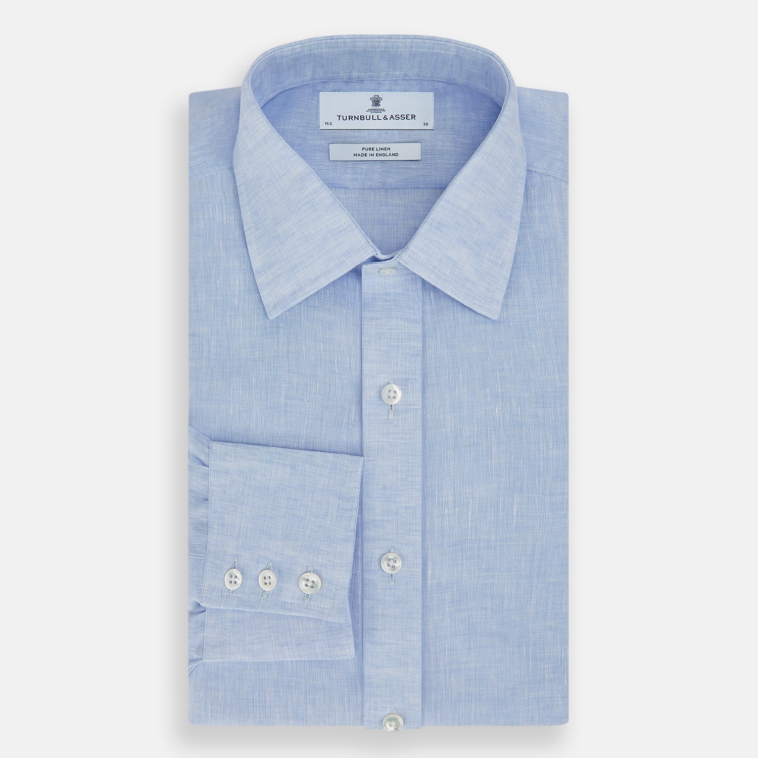View 5 of product The Turnbull & Asser Pale Blue Linen Mayfair Shirt features a collar, front pocket, and white buttons. This long-sleeve shirt is displayed on a white background.