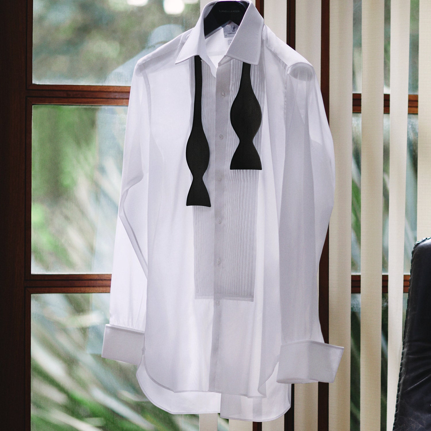 Image 7 of product The Casino Royale Bow Tie by Turnbull & Asser, as seen on James Bond, is a classic black Shantung silk bow tie with a smooth, slightly shiny finish, shown against a plain white background.