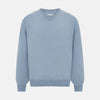 View 1 of product The Turnbull & Asser Frost Blue Cashmere V-Neck Jumper features ribbed cuffs, hem, and neckline. This elegant long sleeve knitwear piece is shown on a plain white background.