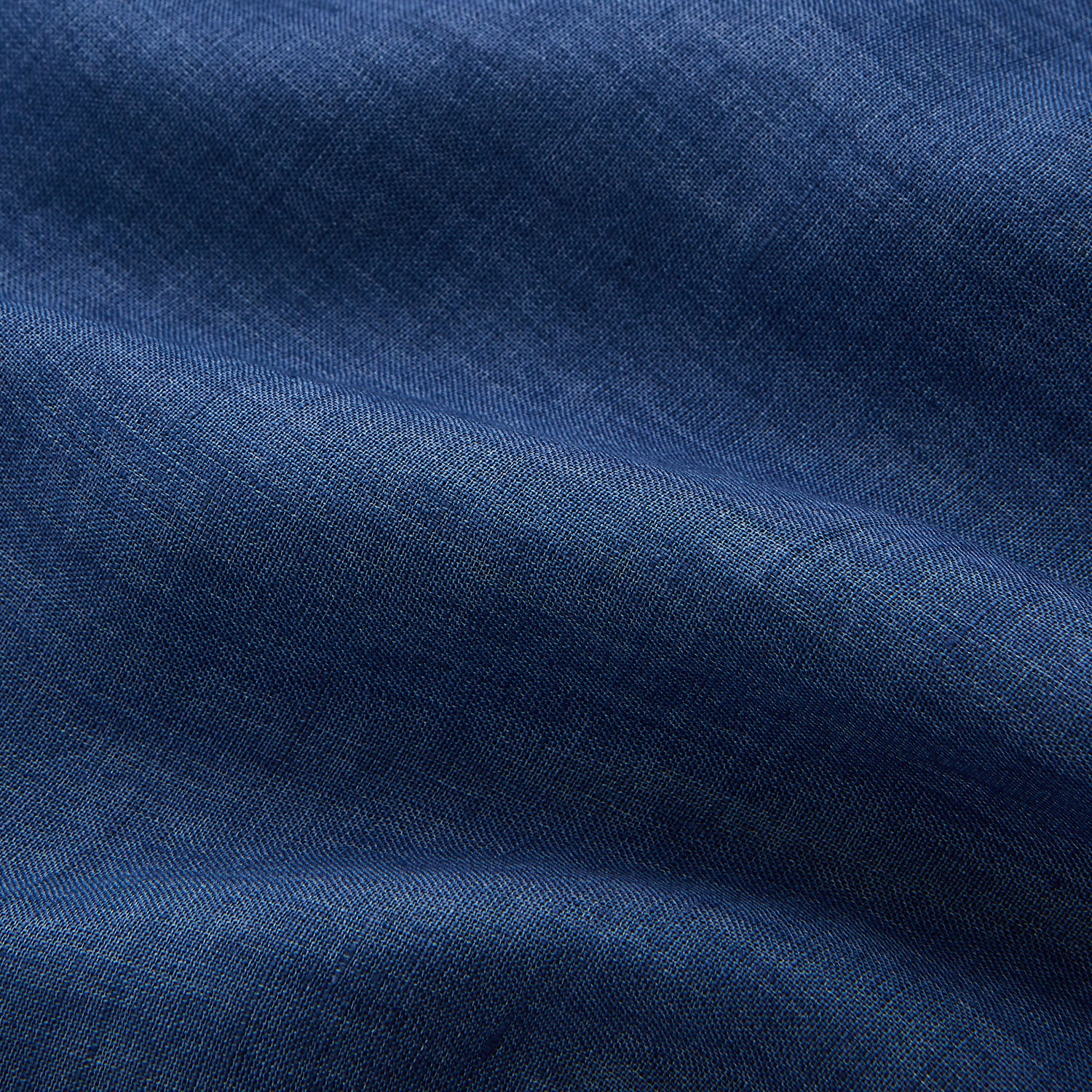 View 5 of product The Blue Weekend Fit Linen Finch Shirt by Turnbull & Asser features a Derby collar, chest pocket, and white buttons. Made from mid-blue linen chambray, it offers effortless casual style when laid flat on a plain white background.