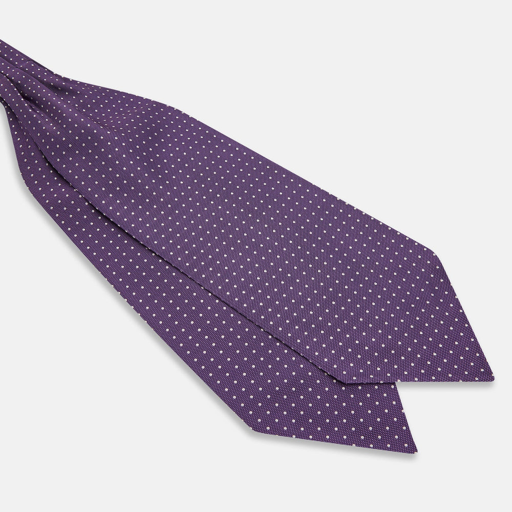The Lilac and Purple Micro Dot Silk Cravat by Turnbull & Asser features evenly spaced white dots—offering an elegant, handmade accent to your formal ensemble or pocket square collection.