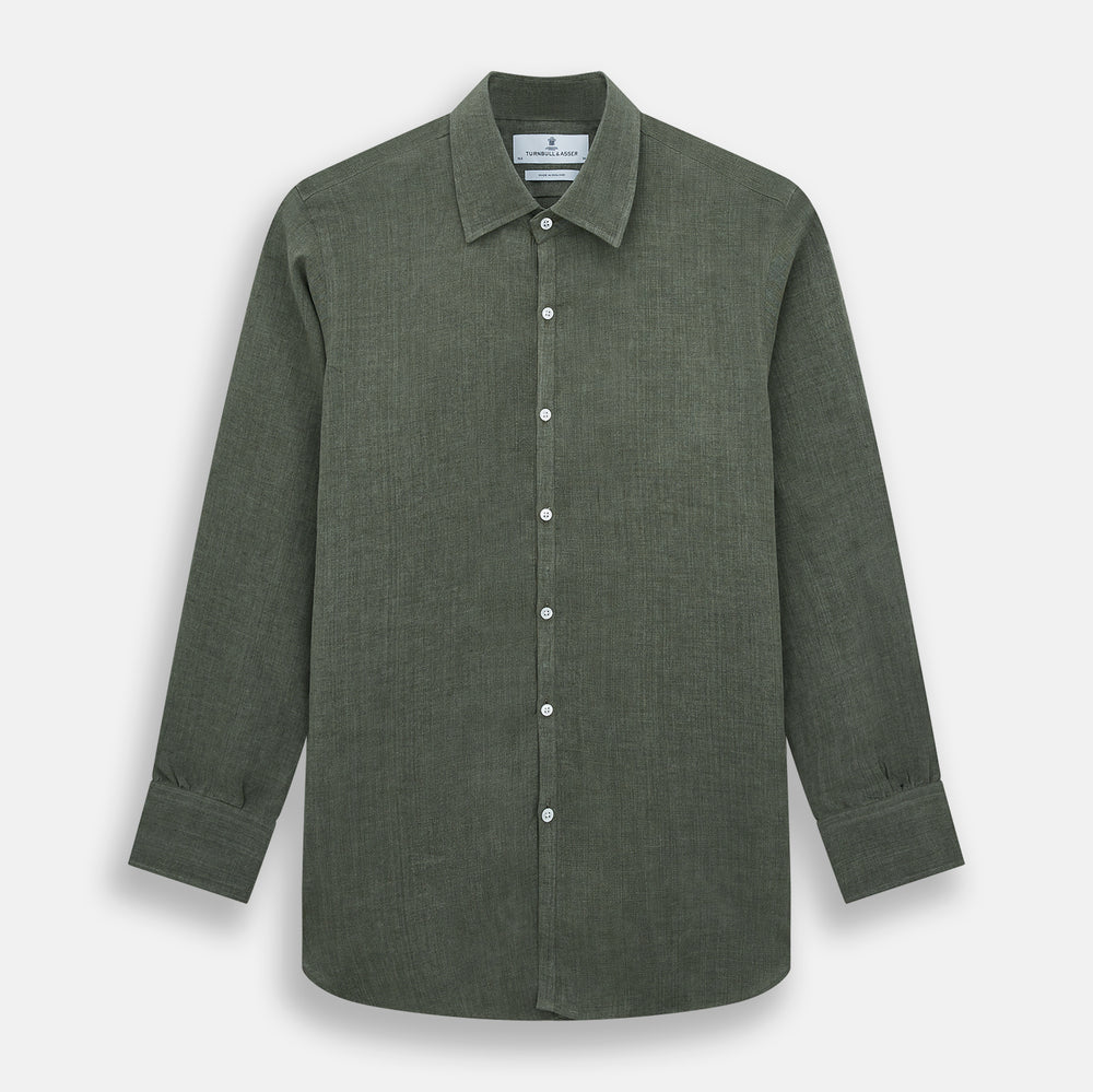 The Sage Linen Westminster Shirt by Turnbull & Asser features long sleeves, a button-up front with white buttons, a pointed Turnbull collar, and buttoned cuffs—crafted in Britain and shown here against a plain white background.