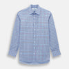 View 1 of product The Turnbull & Asser Blue and Burgundy Windowpane Mayfair Shirt features long sleeves, a light blue base with burgundy windowpane checks, a classic collar, and white buttons.