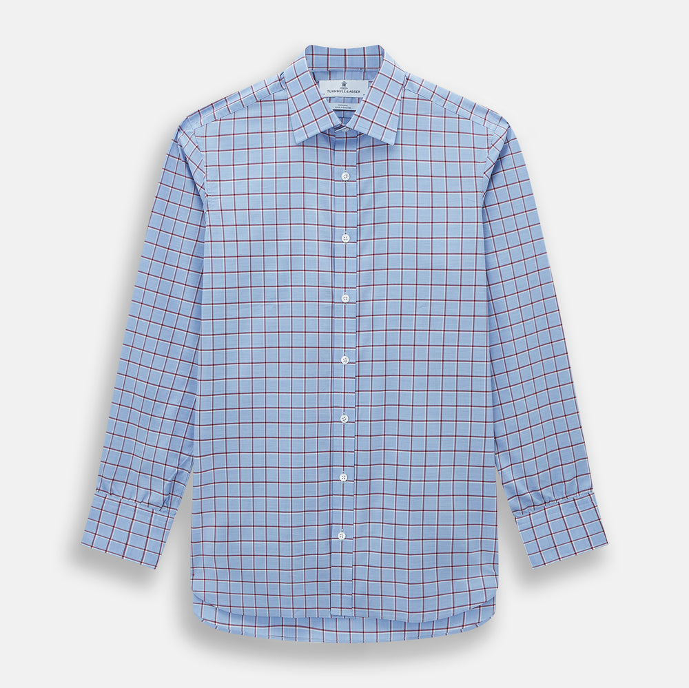 The Turnbull & Asser Blue and Burgundy Windowpane Mayfair Shirt features long sleeves, a light blue base with burgundy windowpane checks, a classic collar, and white buttons.