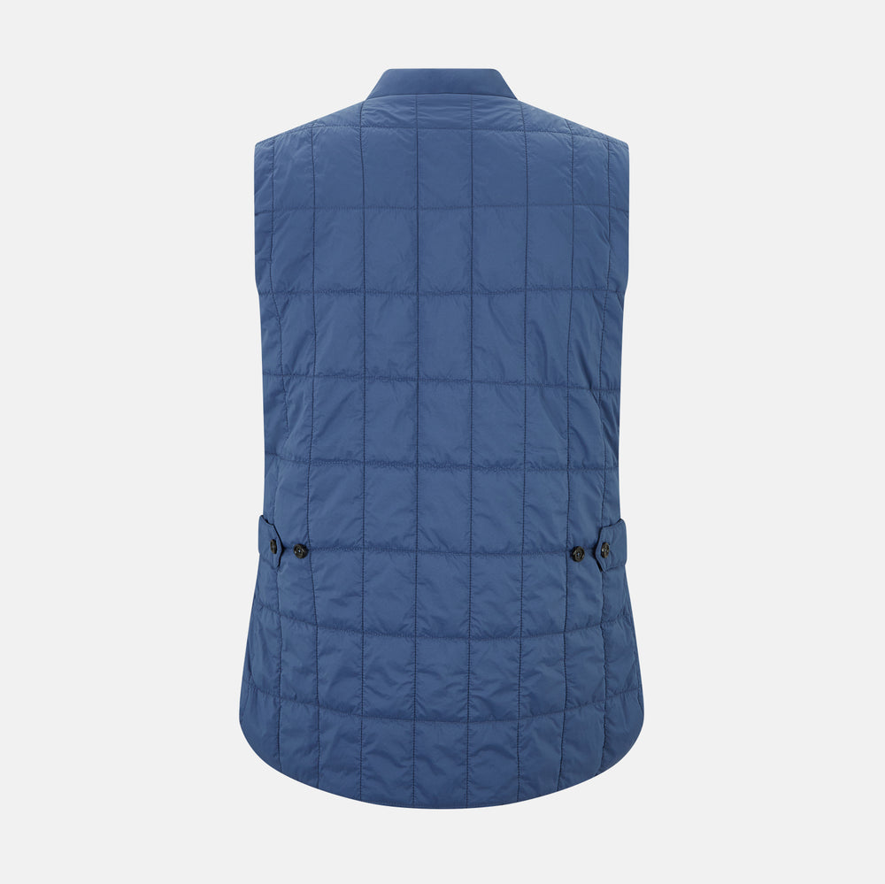 The Azzurro Quilted Gilet by Turnbull & Asser is a sleeveless, lightweight men’s outerwear piece featuring a front zipper, angled zippered pockets, and a chest pocket, shown against a plain white background.