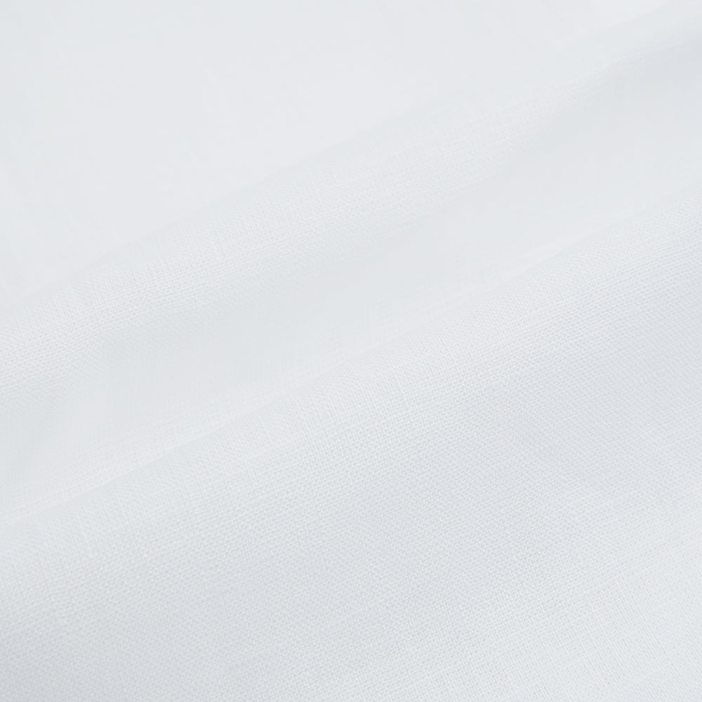 The White Linen Westminster Shirt by Turnbull & Asser features a classic Turnbull collar and button-down front, highlighting British craftsmanship against a plain white background.