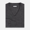 View 4 of product The Charcoal Grey Cashmere V-neck Jumper by Turnbull & Asser features ribbed cuffs, hem, and neckline—an essential knitwear piece, shown on a white background.