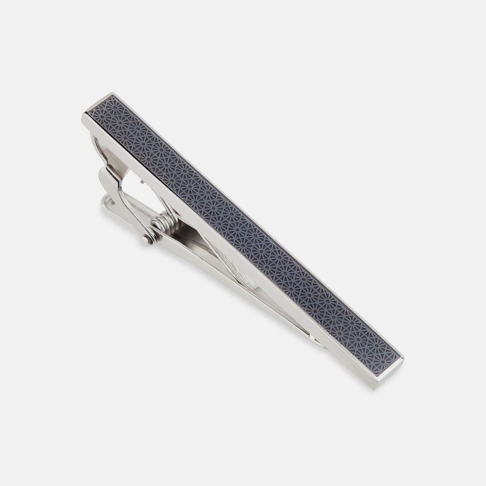 The Turnbull & Asser Navy Patterned Tie Bar, crafted in sterling silver with a geometric navy design, is shown on a plain white background.