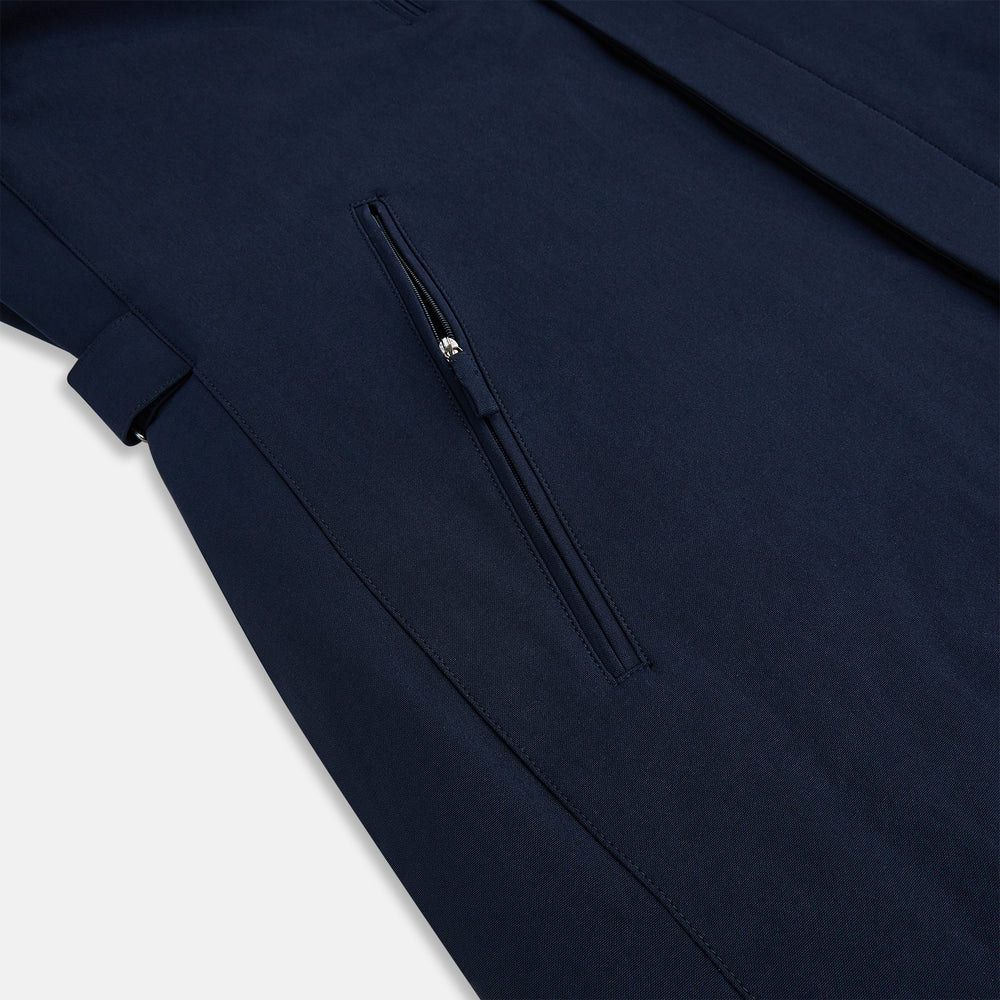 A Navy John Arthur Trench Coat by Turnbull & Asser, featuring a collar, button closure, adjustable cuff straps, two slanted front pockets, and a chest zip pocket, is displayed flat on a white background.
