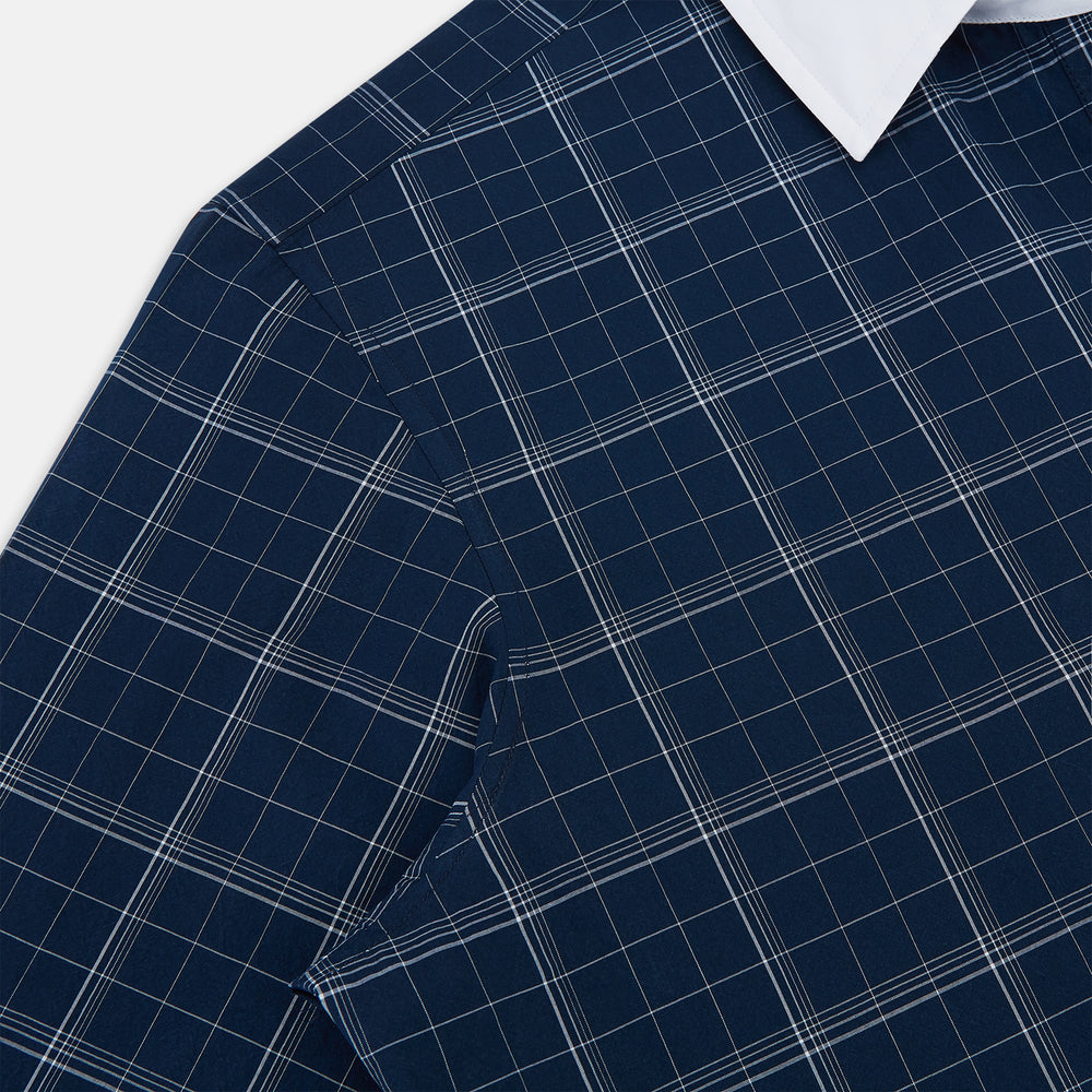 The Turnbull & Asser Indigo Windowpane Check Windsor Shirt features a contrast T&A collar and cuffs, highlighting British craftsmanship. It is displayed flat on a white background.