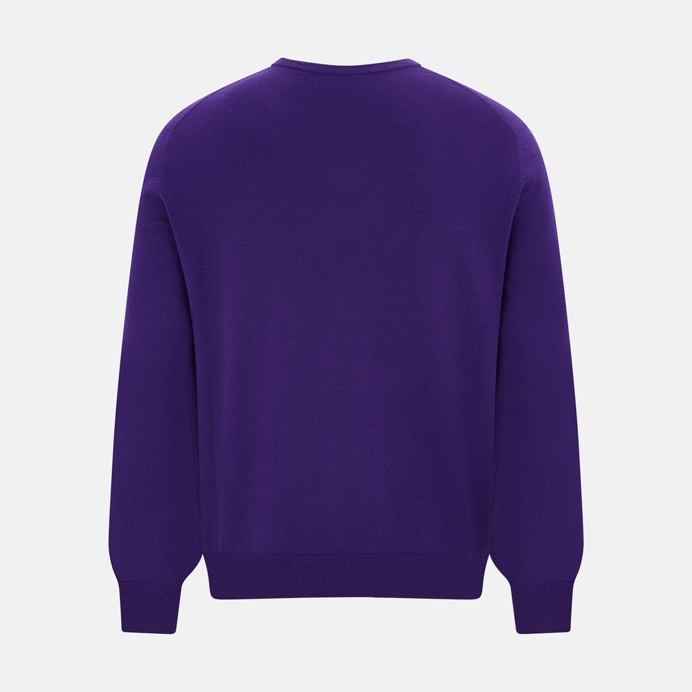 The Turnbull & Asser Purple Merino V-Neck Jumper features long sleeves and a rich, solid hue, making it an essential knitwear piece for any wardrobe.