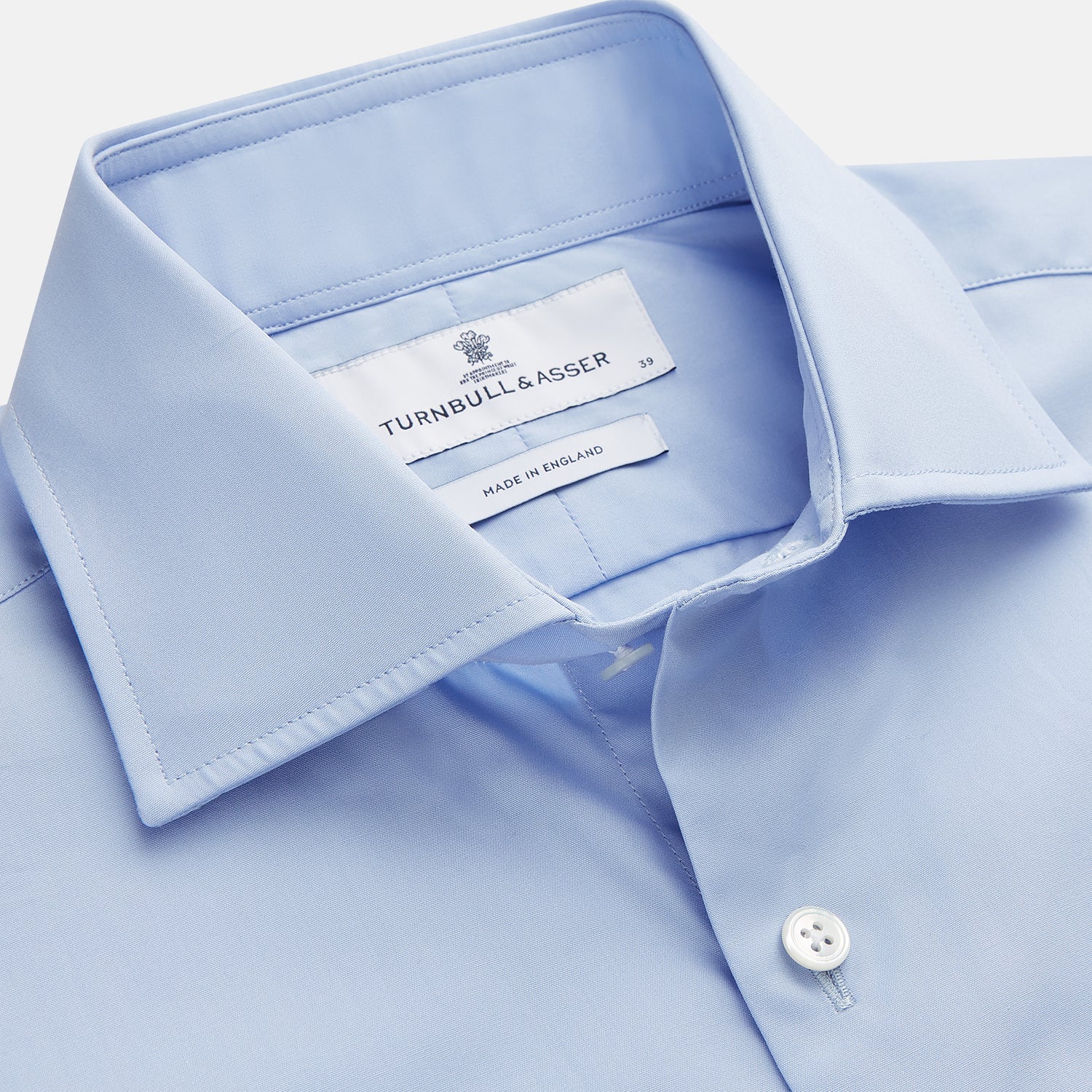 View 2 of product The Turnbull & Asser Tailored Fit Blue Cotton Shirt features a Kent collar and double cuffs—ideal for pairing with a navy suit for a sharp look.