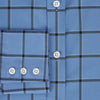 View 4 of product The Turnbull & Asser Colony Blue Grid Check Mayfair Shirt is a light blue, long-sleeve button-up with a collar and evenly spaced dark blue grid lines.