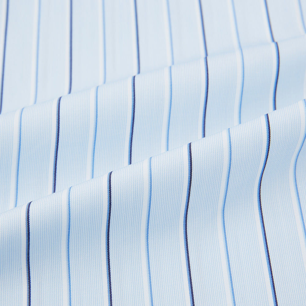 The Turnbull & Asser Navy and Blue Combination Stripe Mayfair Shirt, featuring thin vertical stripes and a classic collar, is displayed laid flat on a white background.