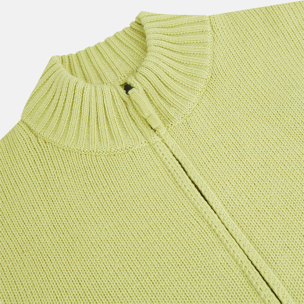 The Melon Green Merino High Neck Zipped Cardigan by Turnbull & Asser features long sleeves and ribbed collar, cuffs, and hem, shown on a plain white background.