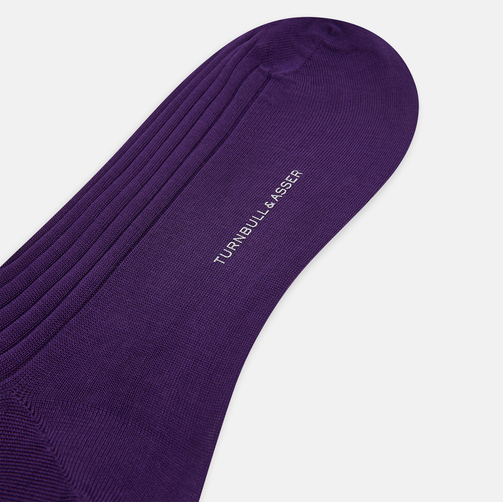 A single knee-high Purple Long Sock from Turnbull & Asser, made of ribbed mercerised Egyptian cotton, is displayed upright on a plain light gray background.