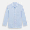 View 1 of product The Turnbull & Asser Pale Blue Linen Pyjama Shirt features long sleeves, a collar, front buttons, and a chest pocket—perfect as elegant loungewear or nightwear.
