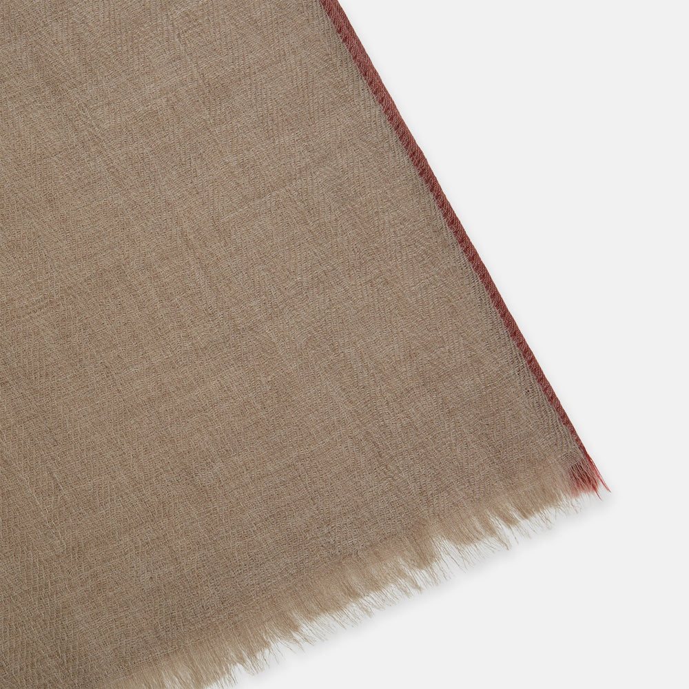The Turnbull & Asser Camel and Cognac Cashmere Scarf features a subtle texture and softly frayed edges, elegantly knotted at the center—an ideal formal accessory. Displayed against a white background.