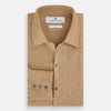 View 5 of product The Turnbull & Asser Camel Linen Windsor Shirt features long sleeves, a tailored fit, and classic collar in light brown camel linen, shown against a white background.