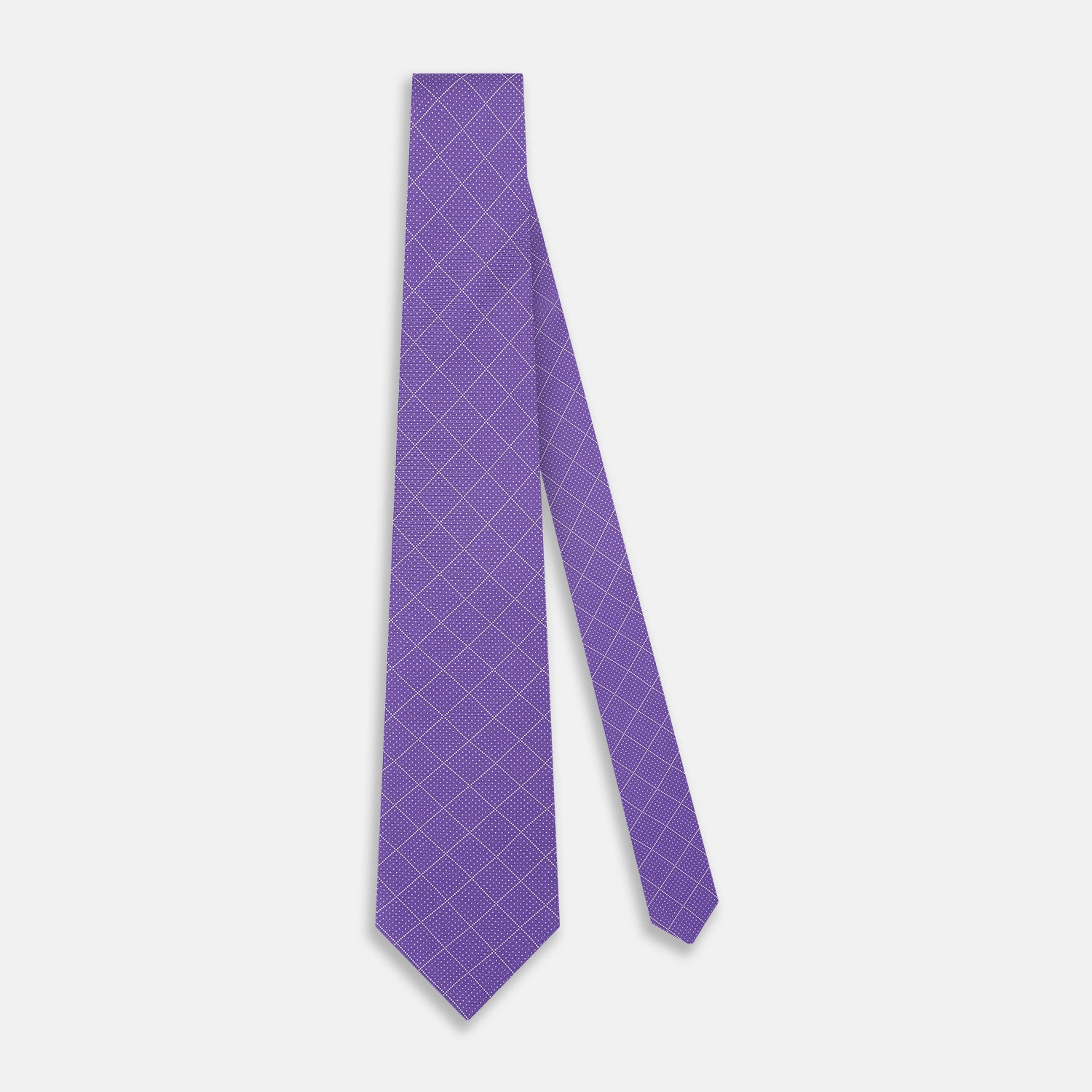 View 2 of product The Turnbull & Asser Purple Dotted Check Pattern Printed Silk Tie is displayed rolled up on a white background, featuring a subtle check design for an elegant look.