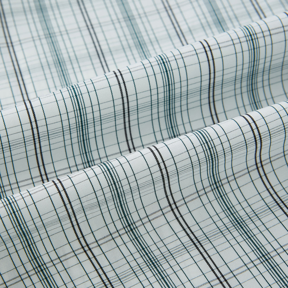 The Turnbull & Asser Forest Green Multi Check Westminster Shirt is a tailored, long-sleeved, button-up shirt with a collar and a white base featuring light blue and green plaid, displayed flat on a white background.