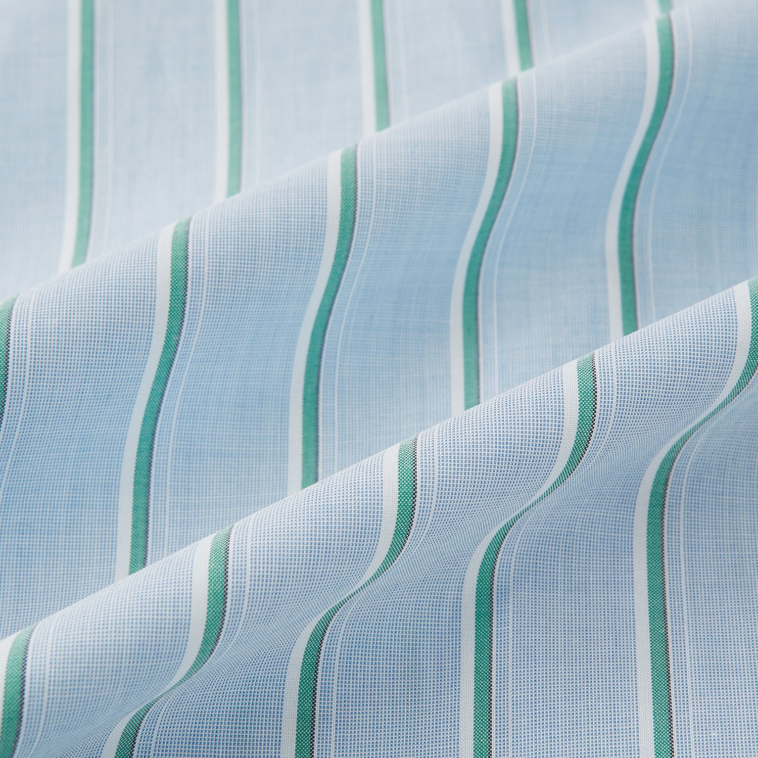Image 8 of product Blue and green multi-stripe Westminster shirt by Turnbull & Asser, featuring a pointed collar and buttoned cuffs—a refined example of British craftsmanship on a plain white background.