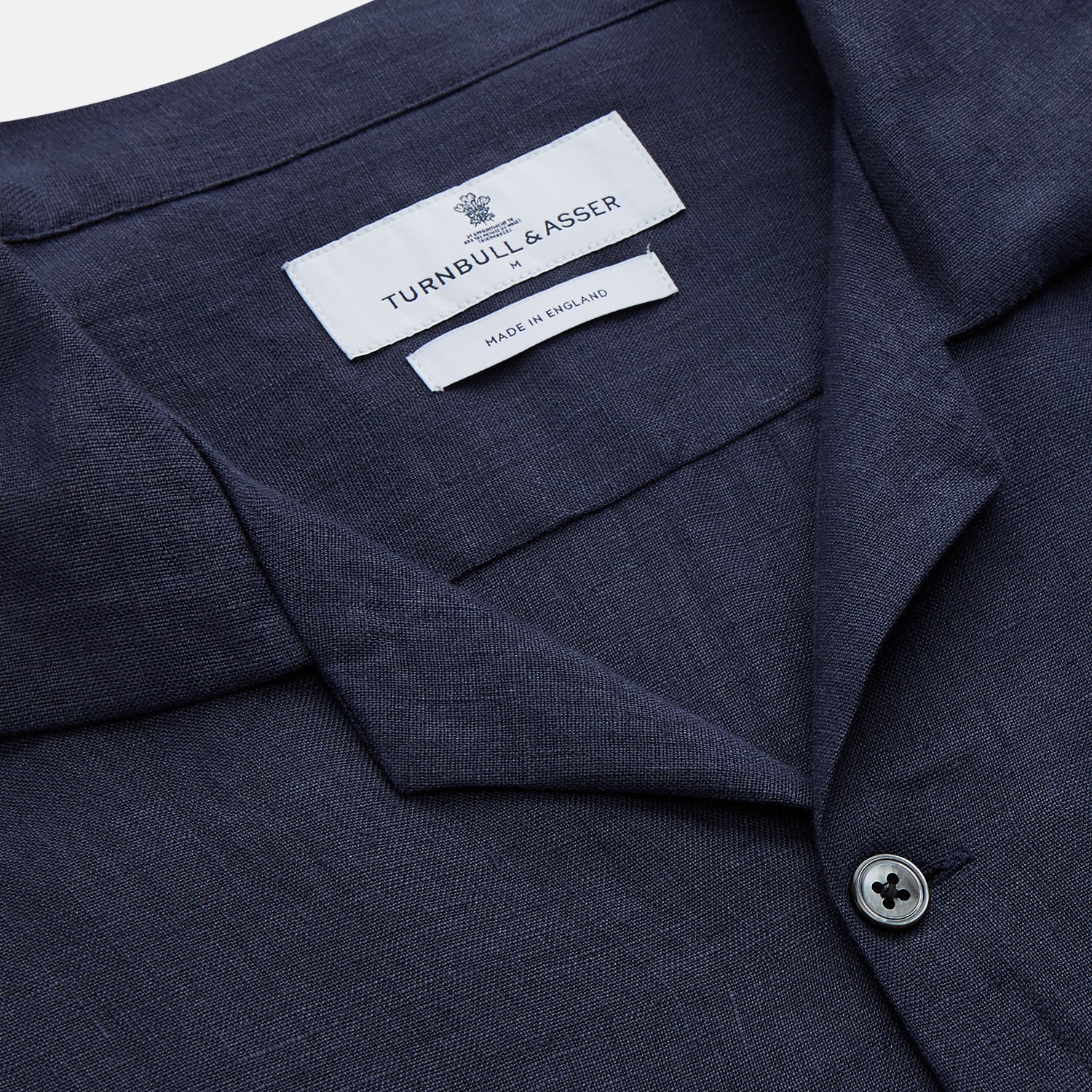 View 2 of product The Turnbull & Asser Navy Hemp Holiday Fit Winnington Shirt is a long-sleeve, button-up shirt with a single chest pocket, shown laid flat on a white background.