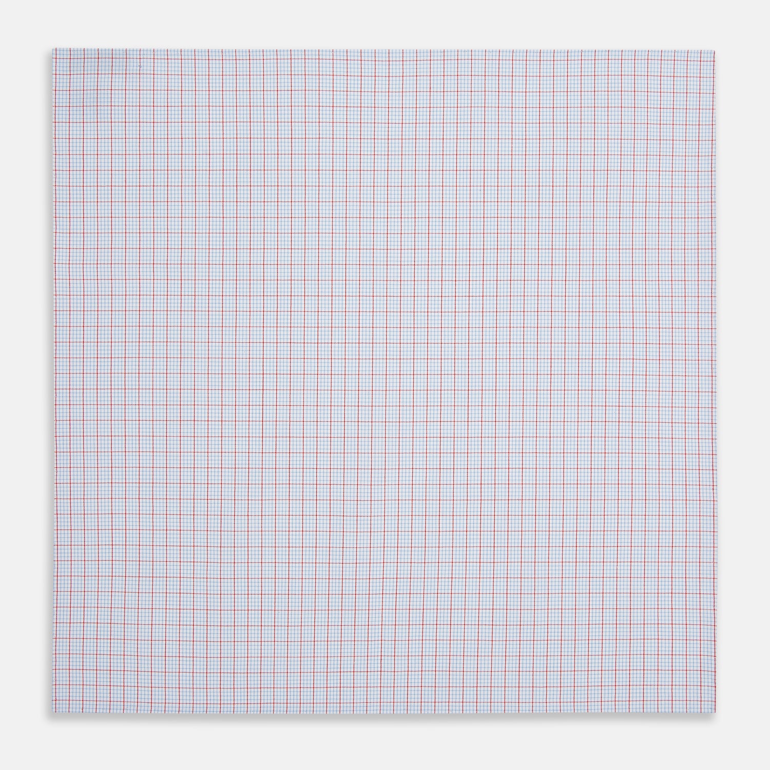 View 3 of product The Turnbull & Asser Hand Rolled Red Multi Graph Check Handkerchief features blue and red grid lines on white, with a red check forming larger squares and blue lines creating smaller squares within the design.