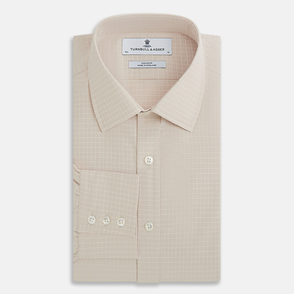 The Turnbull & Asser Pale Pink Fine Check Mayfair Shirt features long sleeves, a collared neckline, buttoned cuffs, and a subtle check pattern in sanforised cotton, displayed against a white background.