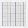 View 1 of product The Turnbull & Asser Dark Navy Double-Line Check Hand-Rolled Handkerchief features a white base with intersecting navy lines and hand-rolled edges, expertly crafted in England.