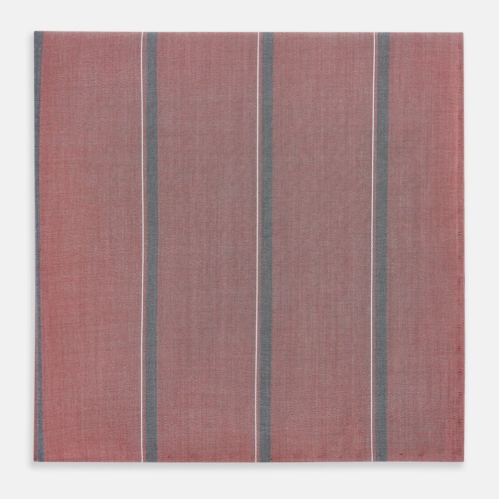 The Red Track Stripe Hand-Rolled Handkerchief by Turnbull & Asser features vertical gray and thin white stripes on red, a subtle woven texture, and elegant hand-rolled edges. Made in England.