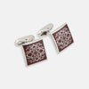 View 1 of product Turnbull & Asser Burgundy Floral Square Cufflinks feature a reddish-brown enamel face with an intricate white mandala pattern at the center, all set in elegant sterling silver.