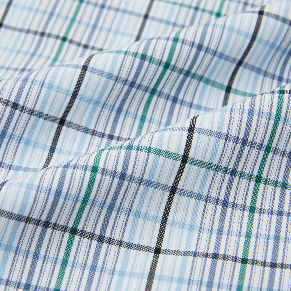 Turnbull & Asser’s Blue and Green Multi Check Pyjama Shirt features long sleeves and a button-up design with a blue and green plaid pattern—ideal for elegant loungewear or stylish nightwear.