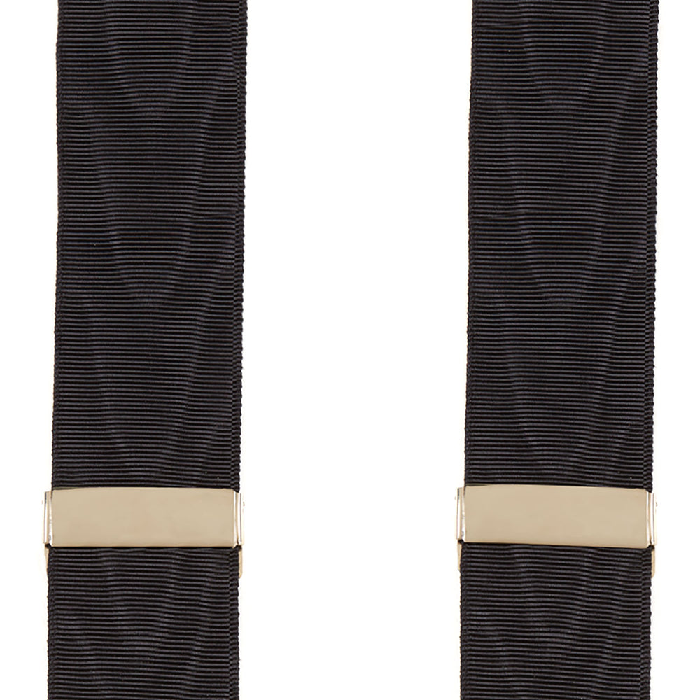 Turnbull & Asser Black Adjustable Formal Braces featuring leather ends and beige metal adjusters, made in England, shown on a white background.