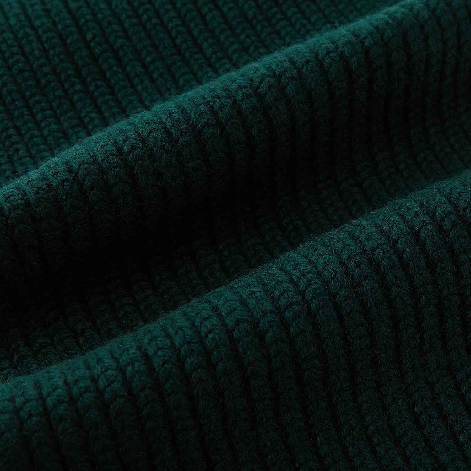 Image 3 of product The Turnbull & Asser Forest Green Rib-Knit Cashmere Scarf is shown neatly looped and ribbed, set against a plain white background.