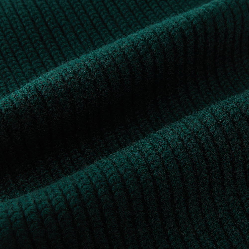 The Turnbull & Asser Forest Green Rib-Knit Cashmere Scarf is shown neatly looped and ribbed, set against a plain white background.