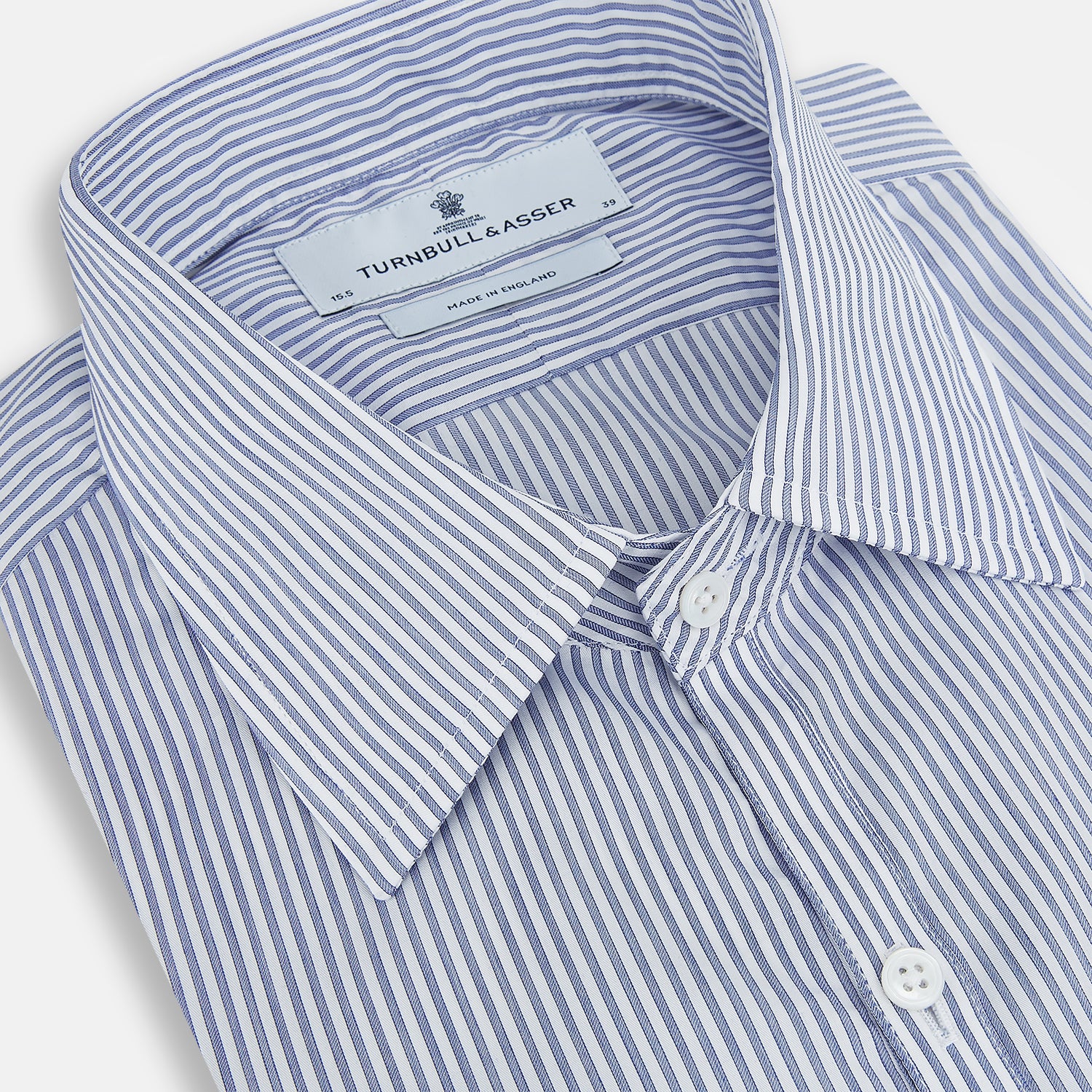 View 2 of product The Turnbull & Asser Navy and White Stripe Westminster Shirt features thin vertical stripes, a Turnbull collar, long sleeves, and classic British craftsmanship, shown flat on a white background.