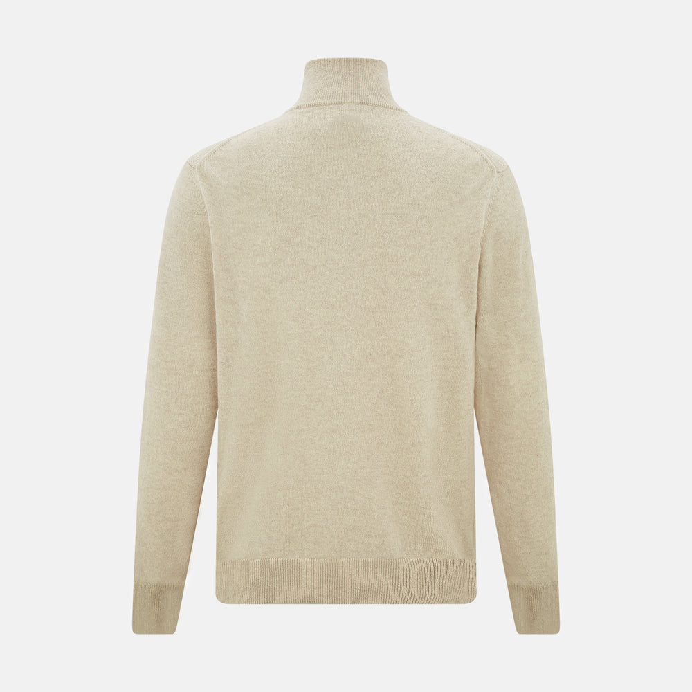 The Turnbull & Asser Cream Half-Zip Cashmere Jumper is a beige, long-sleeve pullover with a high collar, showcasing timeless knitwear style against a plain white background.