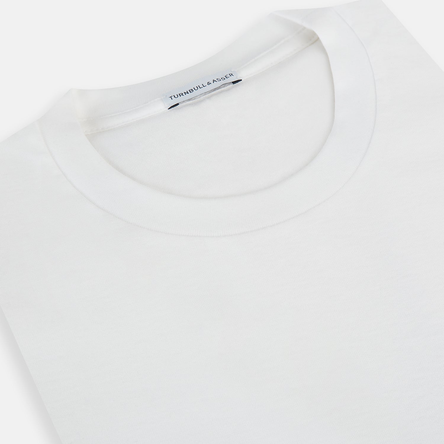 View 9 of product The Turnbull & Asser White Long-Sleeve T-shirt for men is a plain crew neck design with no logos or patterns, displayed flat on a white background.