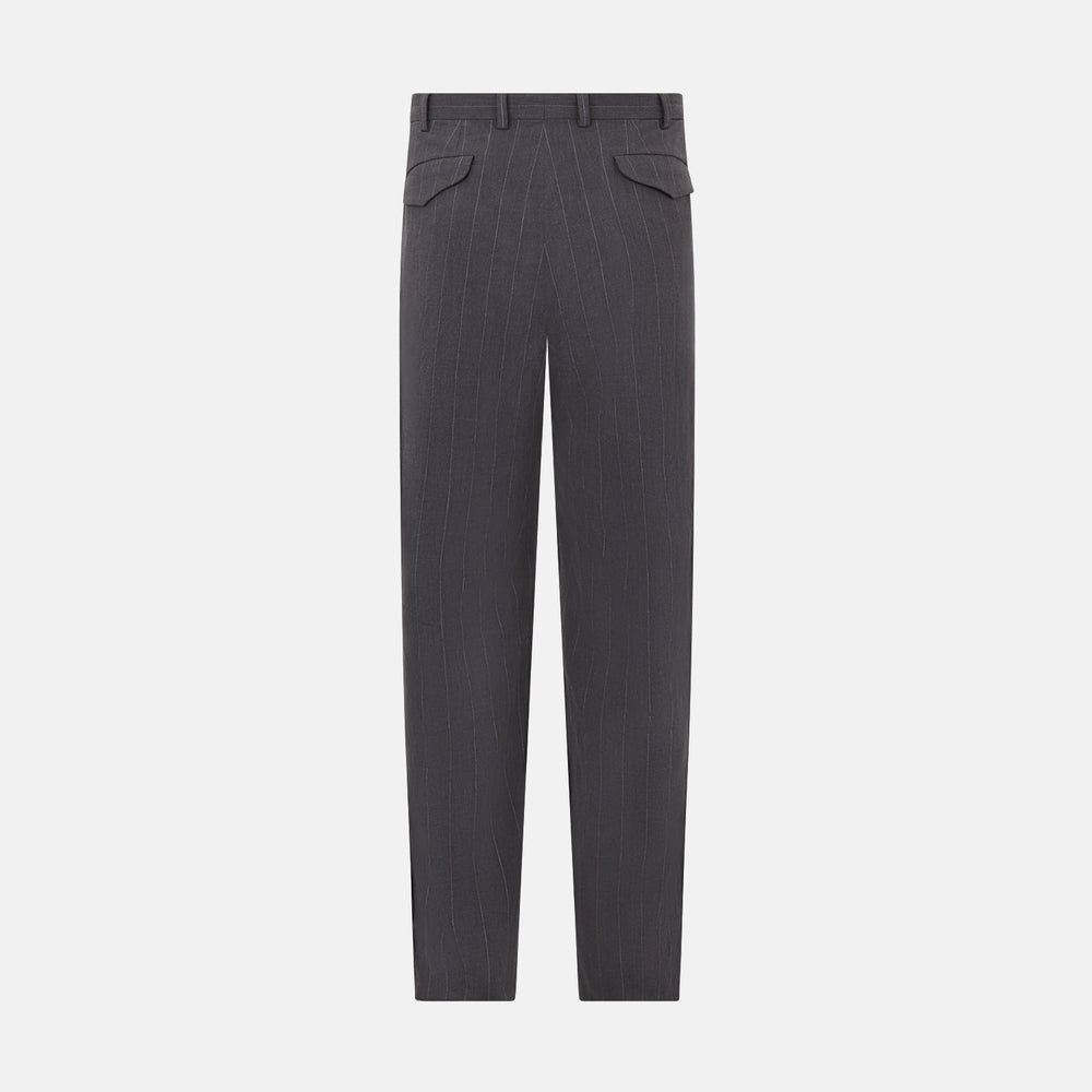 Turnbull & Asser’s Dark Chocolate Striped Edmund trousers feature straight-cut legs, a relaxed fit, button closure, and belt loops. These cotton trousers display subtle vertical stripes against a plain white background.