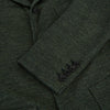 View 4 of product The Turnbull & Asser Forest Green Linen Blend Cambridge Blazer features British tailoring with notch lapels, two front buttons, a chest pocket, and two lower pockets, displayed on a plain white background.