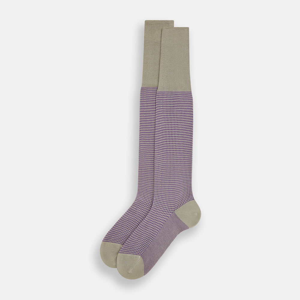 The Concrete Houndstooth Long Sock by Turnbull & Asser features a knee-high design with beige cuff, toe, and heel, plus a purple and black checkered pattern, shown on a plain white background.