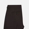 View 5 of product A pair of brown linen Henry trousers by Turnbull & Asser with a straight-leg cut and button waistband, ideal for formalwear, displayed against a plain white background.